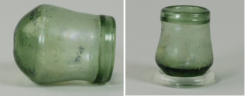 “Cupping glass” discovered in Independence National Historical Park.  The artifact is photographed laying on its side (left) and sitting upright atop a modern glass mounting ring (right). (Photos by A. Keim, Independence National Historical Park, Philadelphia, Pennsylvania.) 