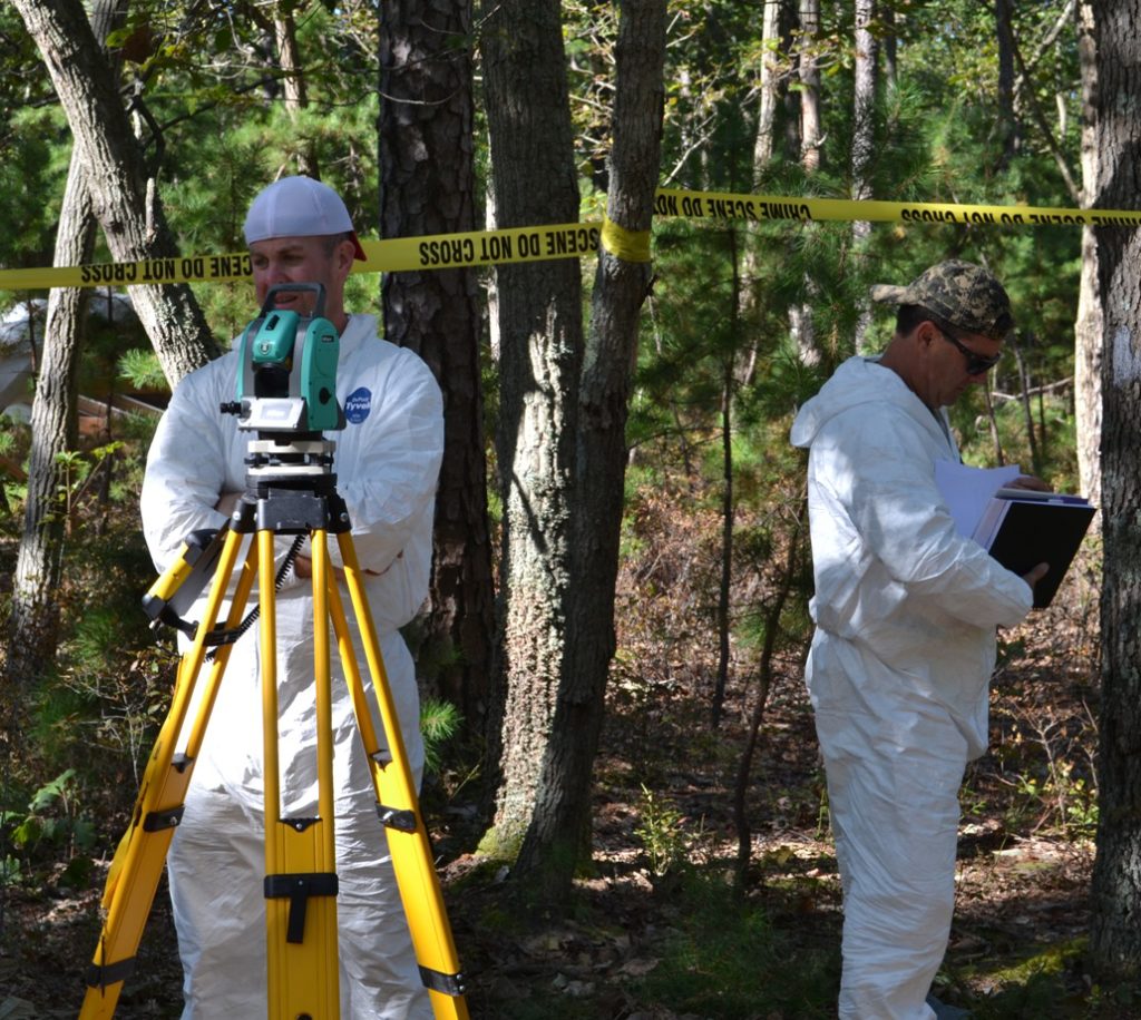 Image 3 – Police officers learn how to use a total station to map an outdoor scene.