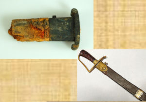 Partial short sword (copper alloy cross guard, wood scabbard core, segment of iron blade) excavated at the site of the National Constitution Center in Independence National Historical Park. Image courtesy of NPS. 